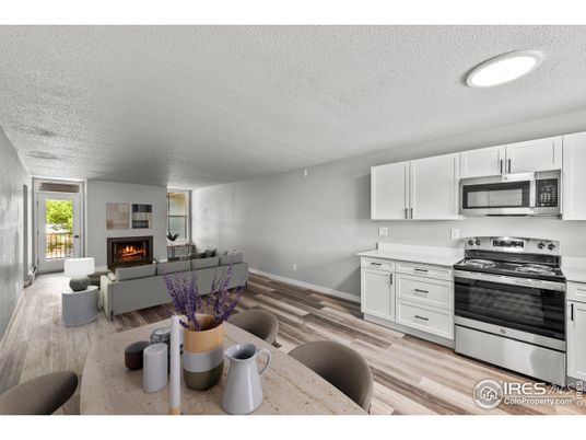 Fireplace, Interior, Kitchen, Living room, Recessed Lighting, Stainless Steel Appliances, Wood Texture Flooring