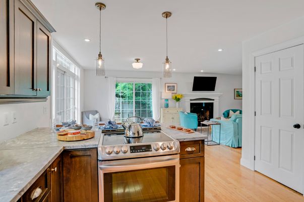 Fireplace, Interior, Kitchen, Living room, Pendant Lights, Recessed Lighting, Stainless Steel Appliances, Wood Texture Flooring