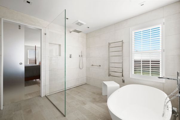 Bathroom, Free Standing Baths, Glass Shower, Interior, Recessed Lighting, Wood Texture Flooring
