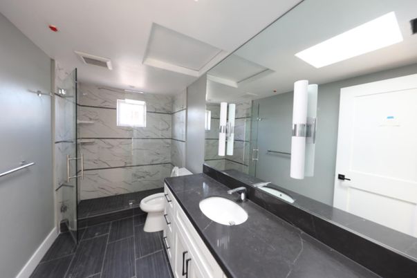 Bathroom, Dual Sink Vanities, Glass Shower, Interior, Marble, Marble Walls, Recessed Lighting