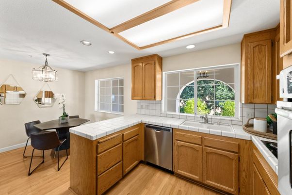 Interior, Kitchen, Recessed Lighting, Tile Countertops, Wood Texture Flooring
