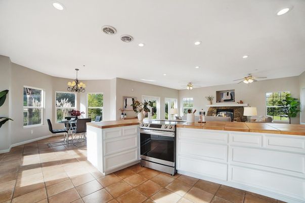 Chandelier, Dining room, Fireplace, Interior, Kitchen, Recessed Lighting, Stainless Steel Appliances