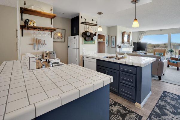 Interior, Kitchen, Pendant Lights, Tile Countertops, Wood Texture Flooring