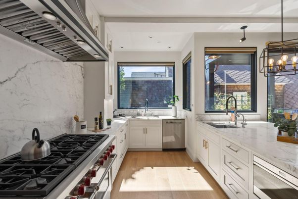 Interior, Kitchen, Marble Walls, Pendant Lights, Recessed Lighting, Stainless Steel Appliances, Wood Texture Flooring