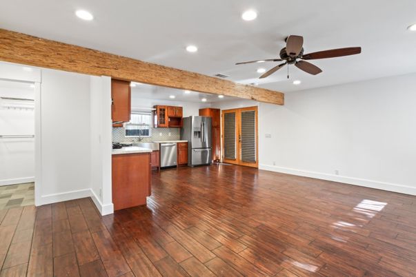 Empty room, Interior, Kitchen, Recessed Lighting, Stainless Steel Appliances, Wooden Beams, Wood Texture Flooring