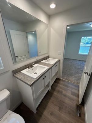Bathroom, Dual Sink Vanities, Interior, Recessed Lighting, Wood Texture Flooring