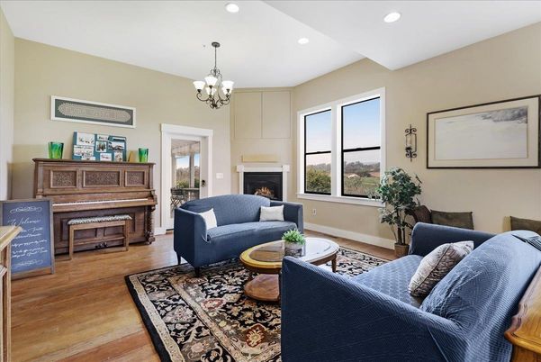 Chandelier, Fireplace, Interior, Living room, Piano, Recessed Lighting, Wood Texture Flooring