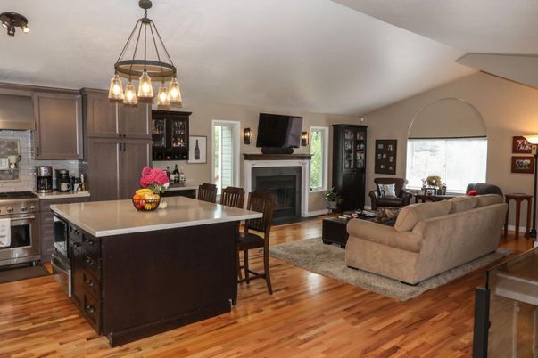 Fireplace, Interior, Kitchen, Living room, Pendant Lights, Stainless Steel Appliances, Wood Texture Flooring