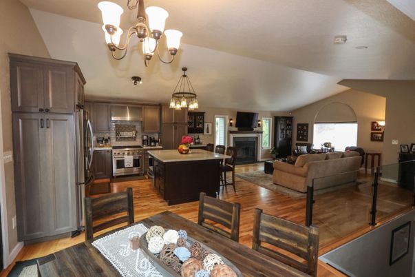 Chandelier, Dining room, Fireplace, Interior, Kitchen, Living room, Stainless Steel Appliances, Wood Texture Flooring