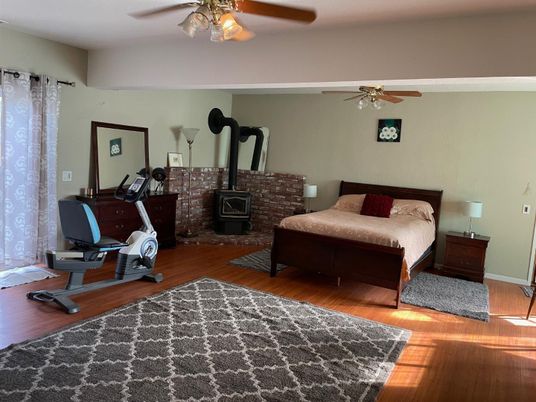 Bedroom, Fireplace, Fitness Equipment, Interior, Wood Texture Flooring