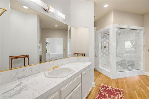 Bathroom, Glass Shower, Interior, Marble Walls, Recessed Lighting, Wood Texture Flooring