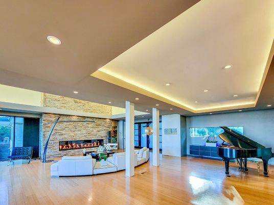 Fireplace, Interior, Living room, Piano, Recessed Lighting, Stone Walls, Wood Texture Flooring