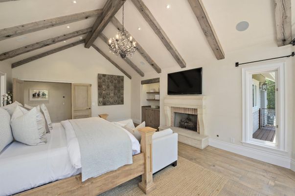 Bedroom, Chandelier, Fireplace, Interior, Recessed Lighting, Wooden Beams, Wood Texture Flooring
