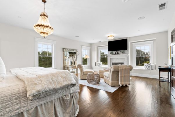 Bedroom, Chandelier, Fireplace, Interior, Recessed Lighting, Wood Texture Flooring