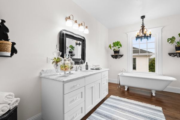Bathroom, Chandelier, Dual Sink Vanities, Free Standing Baths, Interior, Wood Texture Flooring