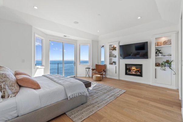 Bedroom, Fireplace, Interior, Recessed Lighting, Water, Wood Texture Flooring