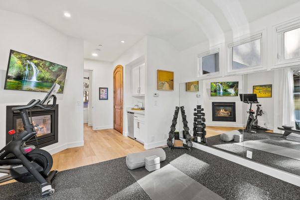 Fireplace, Fitness Equipment, Interior, Recessed Lighting, Wood Texture Flooring