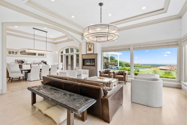 Chandelier, Dining room, Fireplace, Interior, Living room, Pendant Lights, Recessed Lighting, Wood Texture Flooring