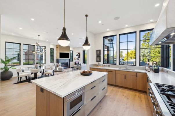 Dining room, Fireplace, Interior, Kitchen, Living room, Pendant Lights, Recessed Lighting, Stainless Steel Appliances, Wood Texture Flooring
