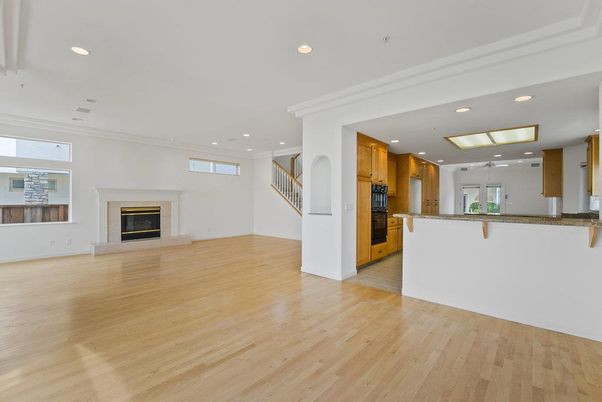 Empty room, Fireplace, Interior, Kitchen, Recessed Lighting, Wood Texture Flooring