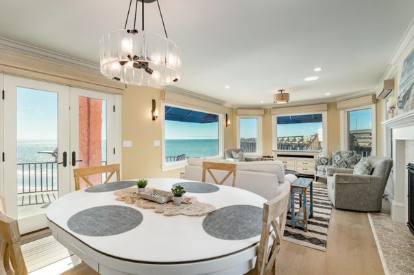 Dining room, Fireplace, Interior, Living room, Pendant Lights, Recessed Lighting, Water, Wood Texture Flooring
