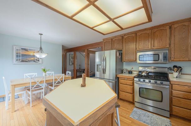 Dining room, Interior, Kitchen, Pendant Lights, Stainless Steel Appliances, Wood Texture Flooring