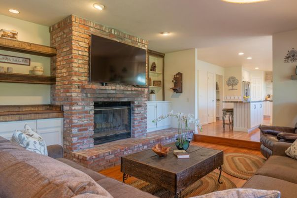 Fireplace, Interior, Living room, Recessed Lighting, Stone Walls, Wood Texture Flooring