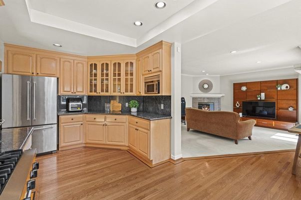 Fireplace, Interior, Kitchen, Living room, Recessed Lighting, Stainless Steel Appliances, Wood Texture Flooring