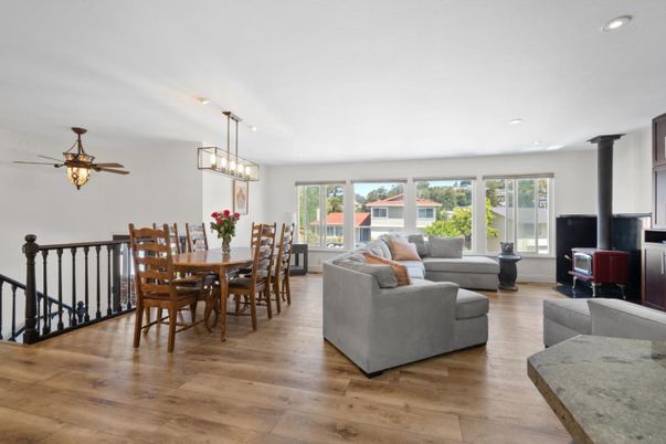 Dining room, Fireplace, Interior, Living room, Pendant Lights, Recessed Lighting, Wood Texture Flooring