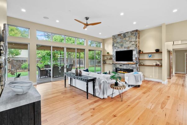 Fireplace, Interior, Living room, Recessed Lighting, Stone Walls, Wood Texture Flooring