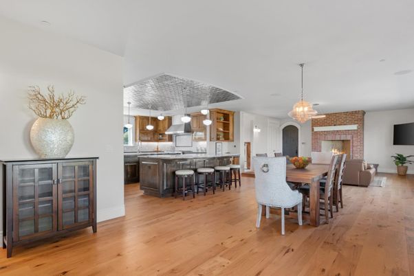Dining room, Fireplace, Interior, Kitchen, Living room, Pendant Lights, Stainless Steel Appliances, Stone Walls, Wood Texture Flooring