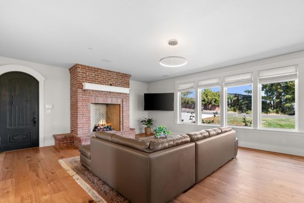 Fireplace, Interior, Living room, Recessed Lighting, Stone Walls, Wood Texture Flooring