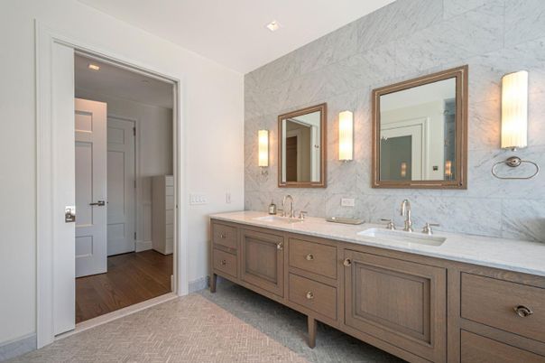 Bathroom, Dual Sink Vanities, Interior, Marble Walls, Recessed Lighting, Wood Texture Flooring