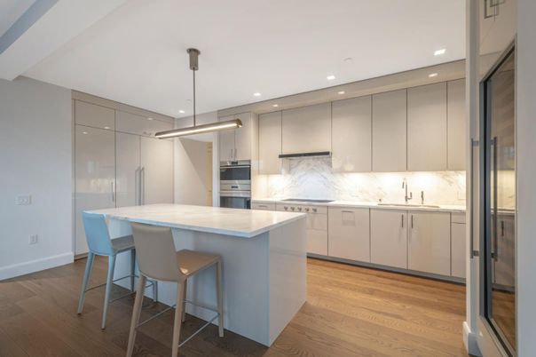 Interior, Kitchen, Marble Walls, Pendant Lights, Recessed Lighting, Stainless Steel Appliances, Wood Texture Flooring
