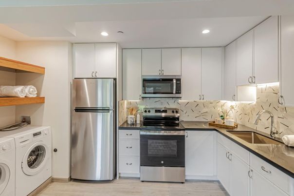 Interior, Kitchen, Recessed Lighting, Stainless Steel Appliances, Washer, Wood Texture Flooring