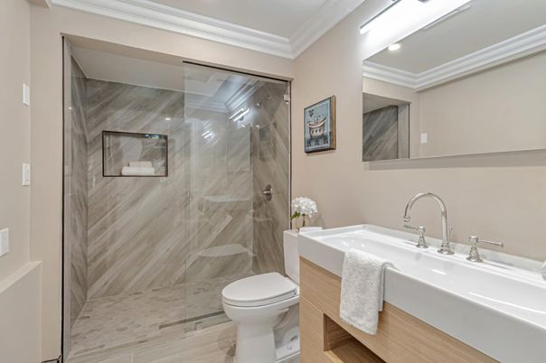 Bathroom, Glass Shower, Interior, Marble Walls, Recessed Lighting, Wood Texture Flooring