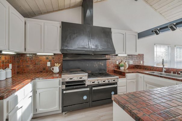 Interior, Kitchen, Stainless Steel Appliances, Tile Countertops, Wood Texture Flooring