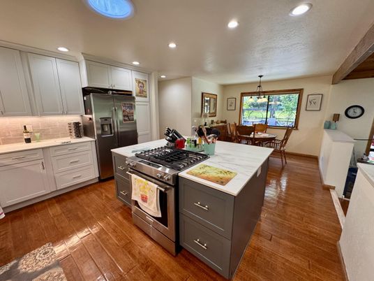 Dining room, Interior, Kitchen, Pendant Lights, Recessed Lighting, Stainless Steel Appliances, Wood Texture Flooring