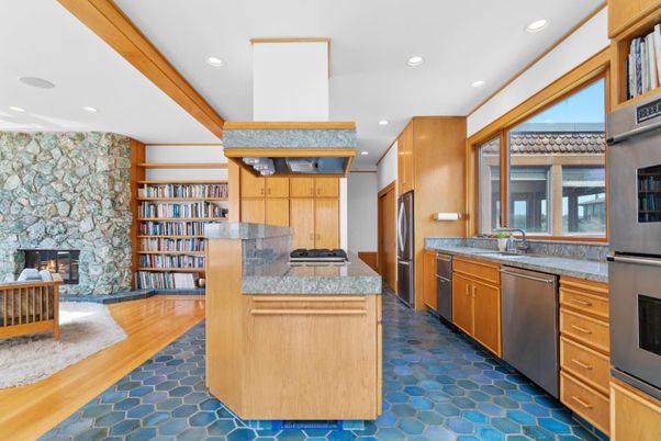 Fireplace, Interior, Kitchen, Recessed Lighting, Stainless Steel Appliances, Stone Walls, Wood Texture Flooring