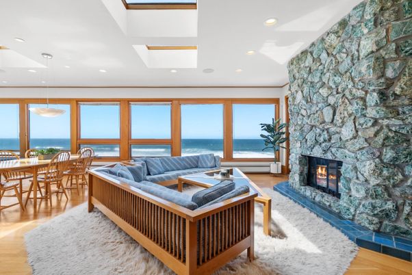Dining room, Fireplace, Interior, Living room, Pendant Lights, Recessed Lighting, Stone Walls, Water, Wood Texture Flooring