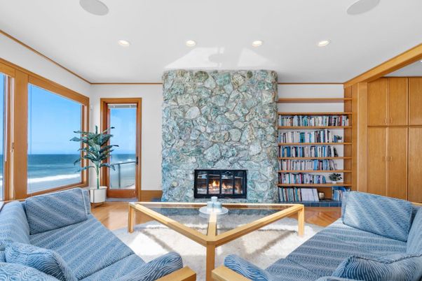 Fireplace, Interior, Living room, Recessed Lighting, Stone Walls, Water, Wood Texture Flooring