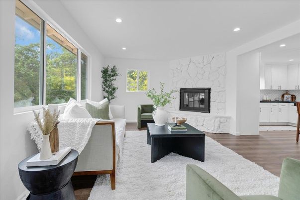 Fireplace, Interior, Living room, Marble Walls, Recessed Lighting, Wood Texture Flooring