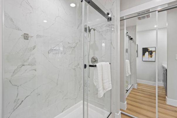 Bathroom, Glass Shower, Interior, Marble Walls, Recessed Lighting, Wood Texture Flooring