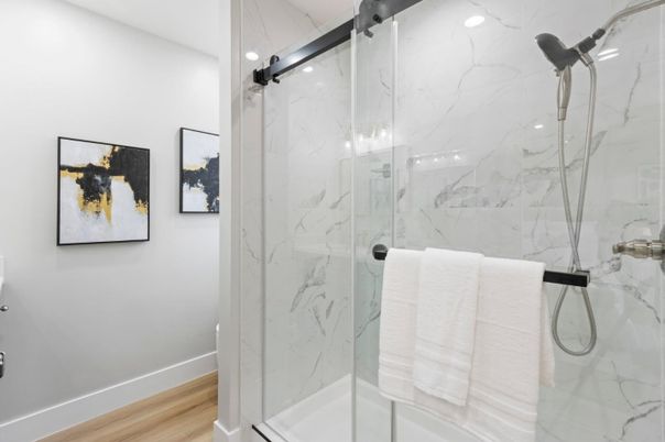Bathroom, Glass Shower, Interior, Marble Walls, Recessed Lighting, Wood Texture Flooring