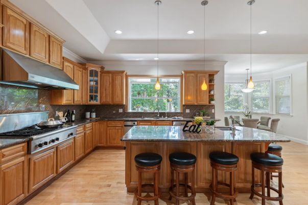 Dining room, Interior, Kitchen, Pendant Lights, Recessed Lighting, Stainless Steel Appliances, Wood Texture Flooring