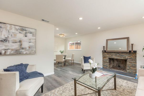 Dining room, Fireplace, Interior, Living room, Recessed Lighting, Wood Texture Flooring