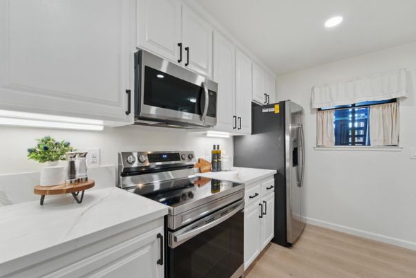 Interior, Kitchen, Recessed Lighting, Stainless Steel Appliances, Wood Texture Flooring