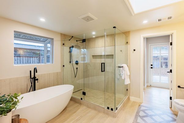 Bathroom, Free Standing Baths, Glass Shower, Interior, Recessed Lighting, Wood Texture Flooring