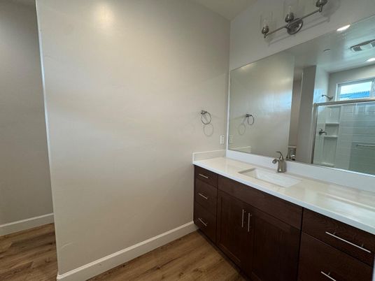 Bathroom, Dual Sink Vanities, Interior, Recessed Lighting, Wood Texture Flooring