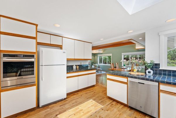 Dining room, Interior, Kitchen, Recessed Lighting, Stainless Steel Appliances, Tile Countertops, Wood Texture Flooring